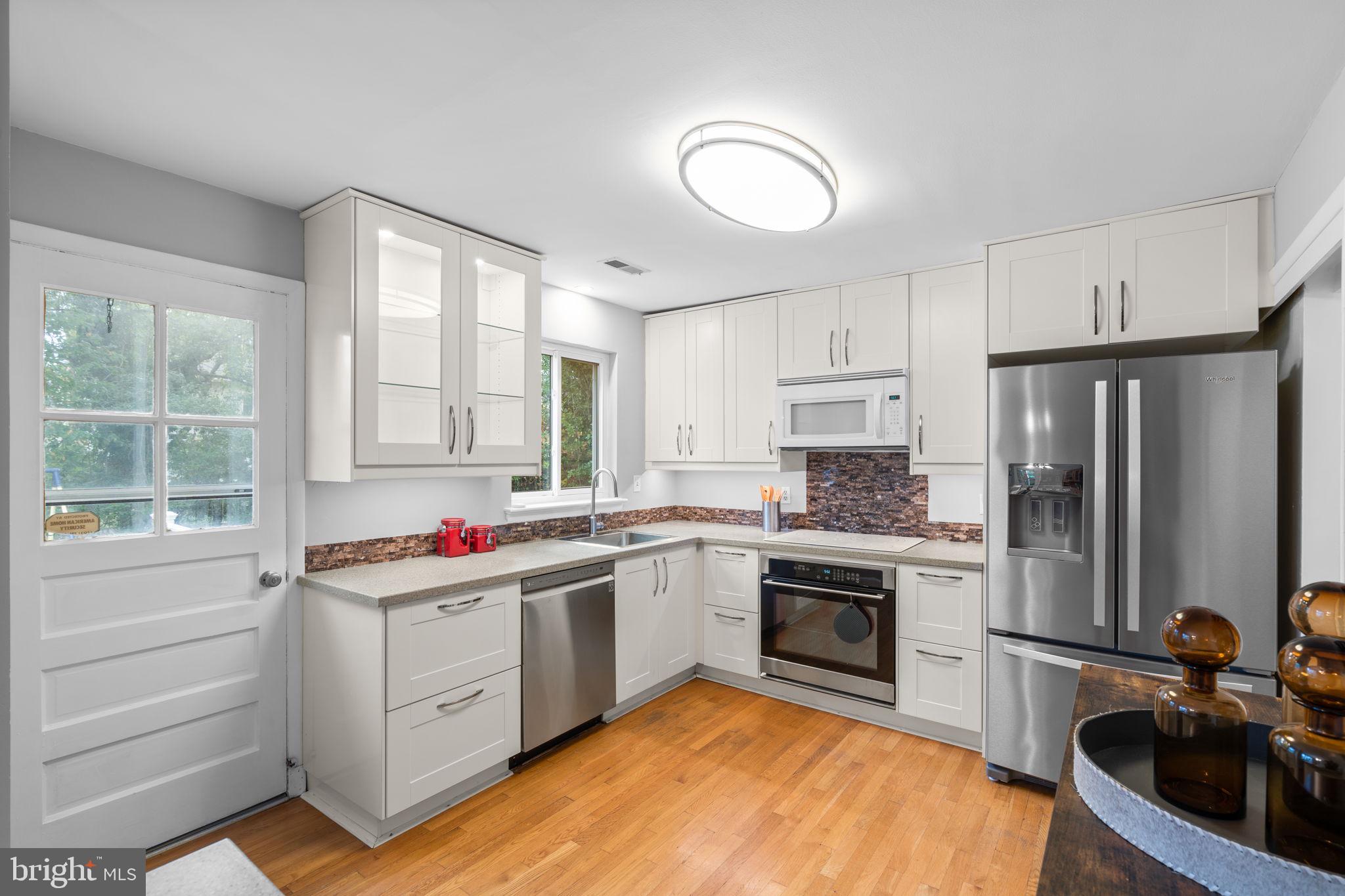 2306 Barbour Road Falls Church, VA 22043 - Photo 13 of 37 a kitchen with a sink stove and refrigerator