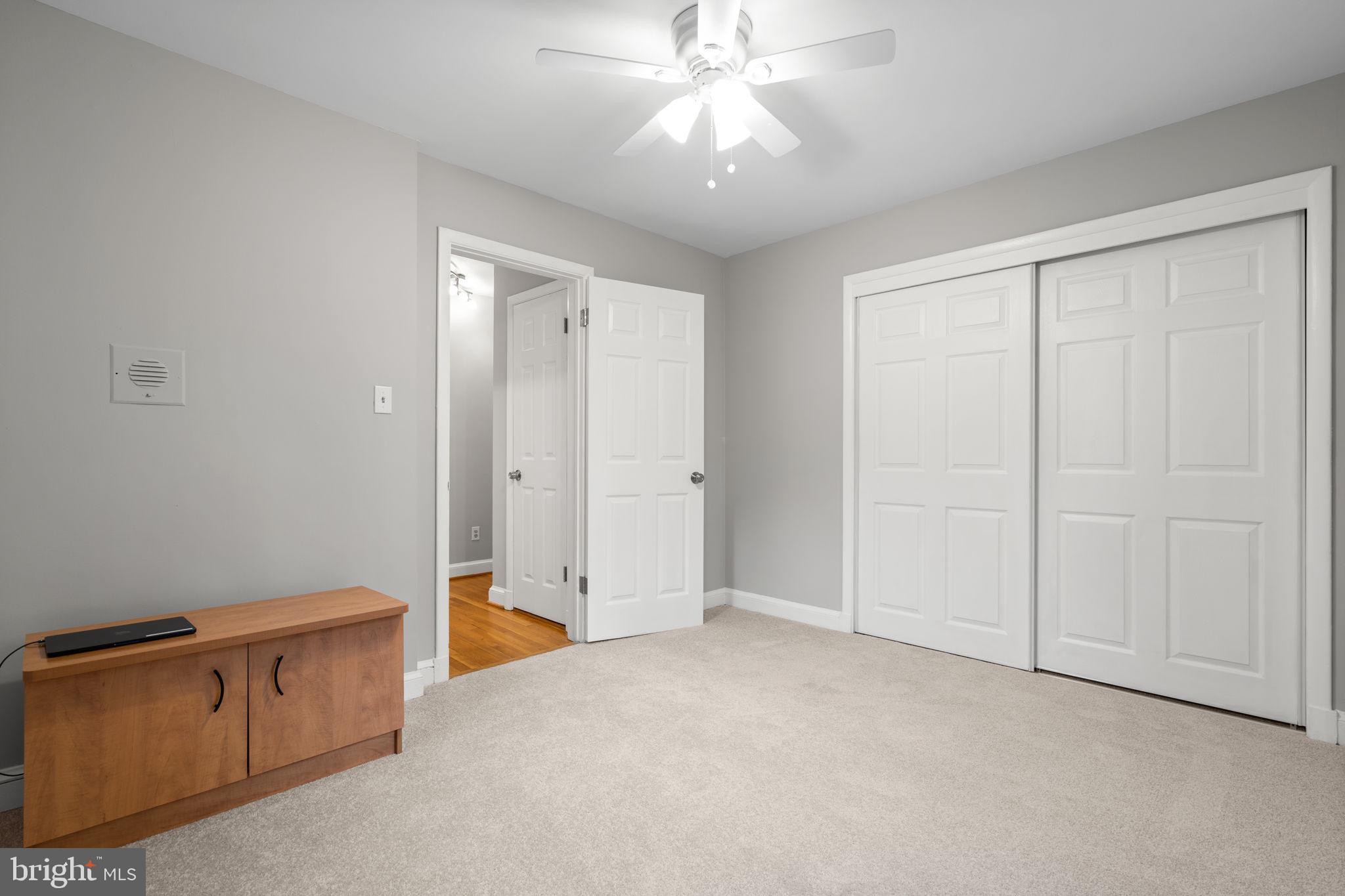 2306 Barbour Road Falls Church, VA 22043 - Photo 19 of 37 an empty room with closet and a chandelier fan