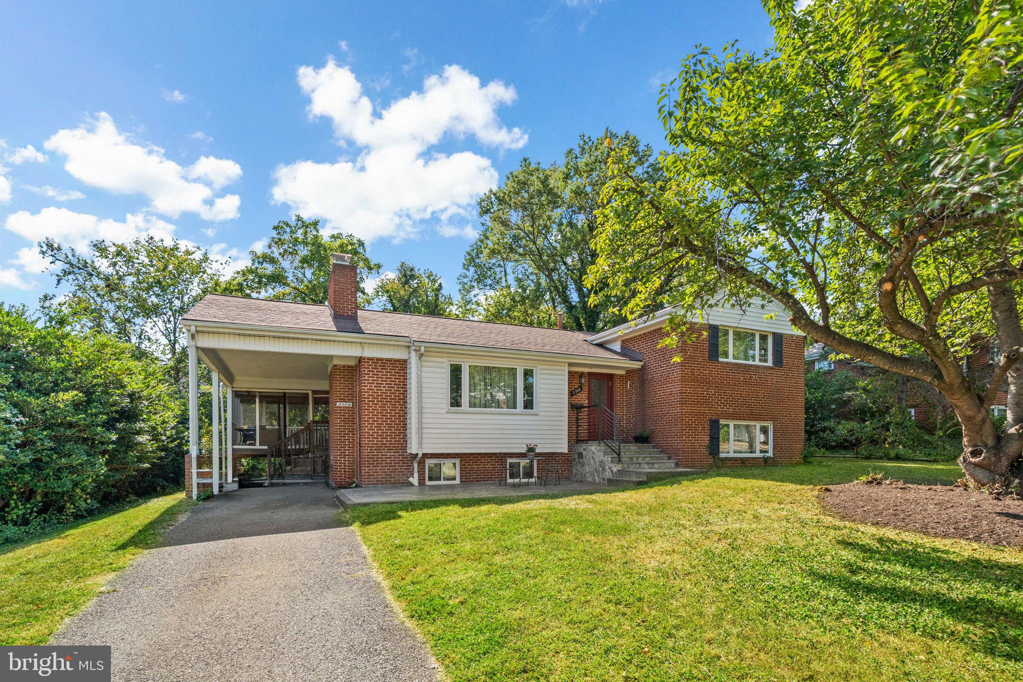 2306 Barbour Road Falls Church, VA 22043 - Photo 2 of 37 a front view of a house with garden