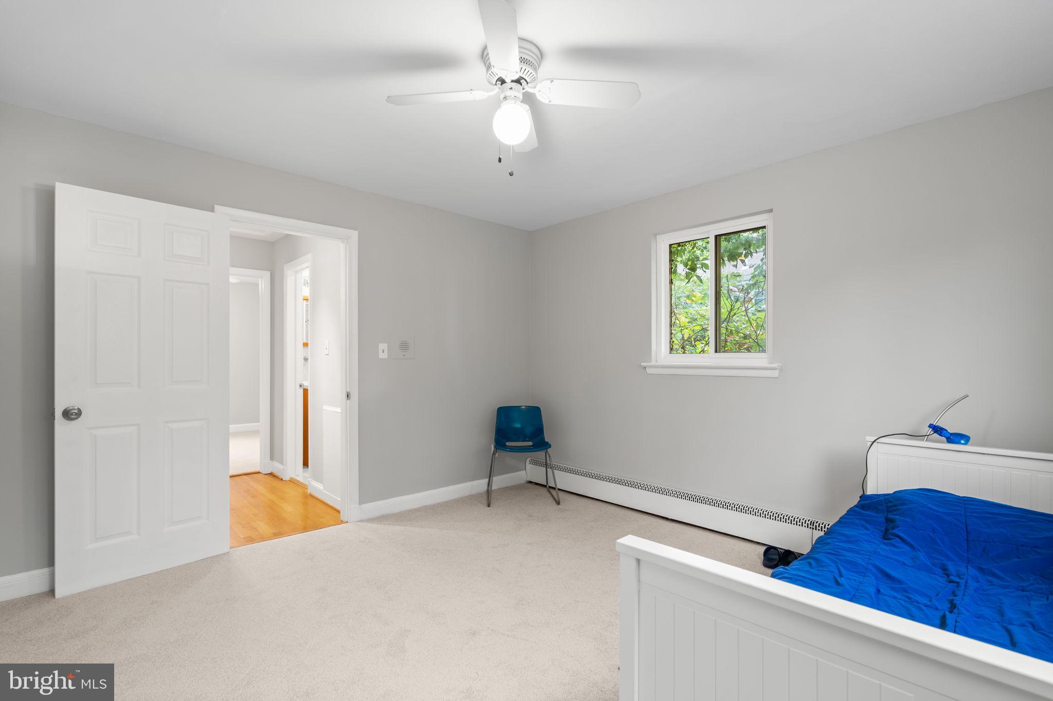 2306 Barbour Road Falls Church, VA 22043 - Photo 21 of 37 a bedroom with a bed and a chandelier