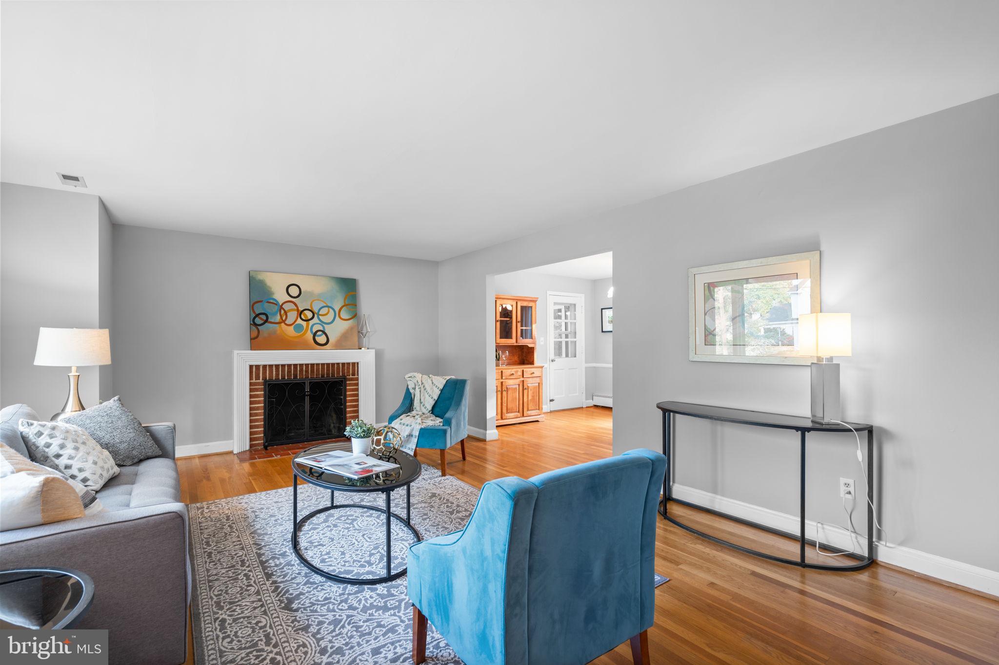 2306 Barbour Road Falls Church, VA 22043 - Photo 7 of 37 a living room with furniture a flat screen tv and a table