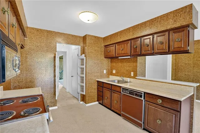 a spacious bathroom with a granite countertop sink and a mirror