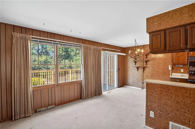 a view of a room with a large window