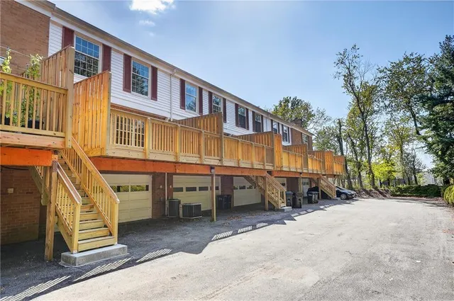 a view of a building with sitting area