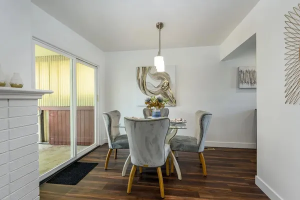 a view of a dining room with furniture window and wooden floor