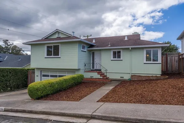 a front view of a house with garage