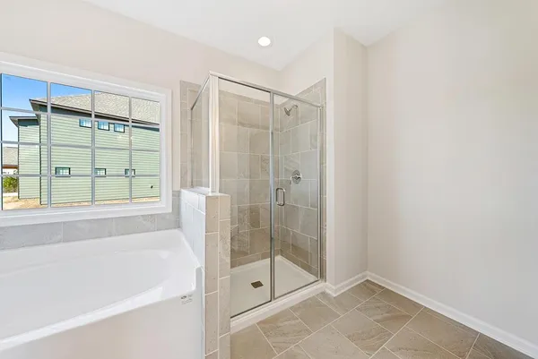 a bathroom with a shower and a bathtub