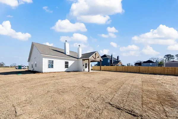 a view of a house with a snow in the background