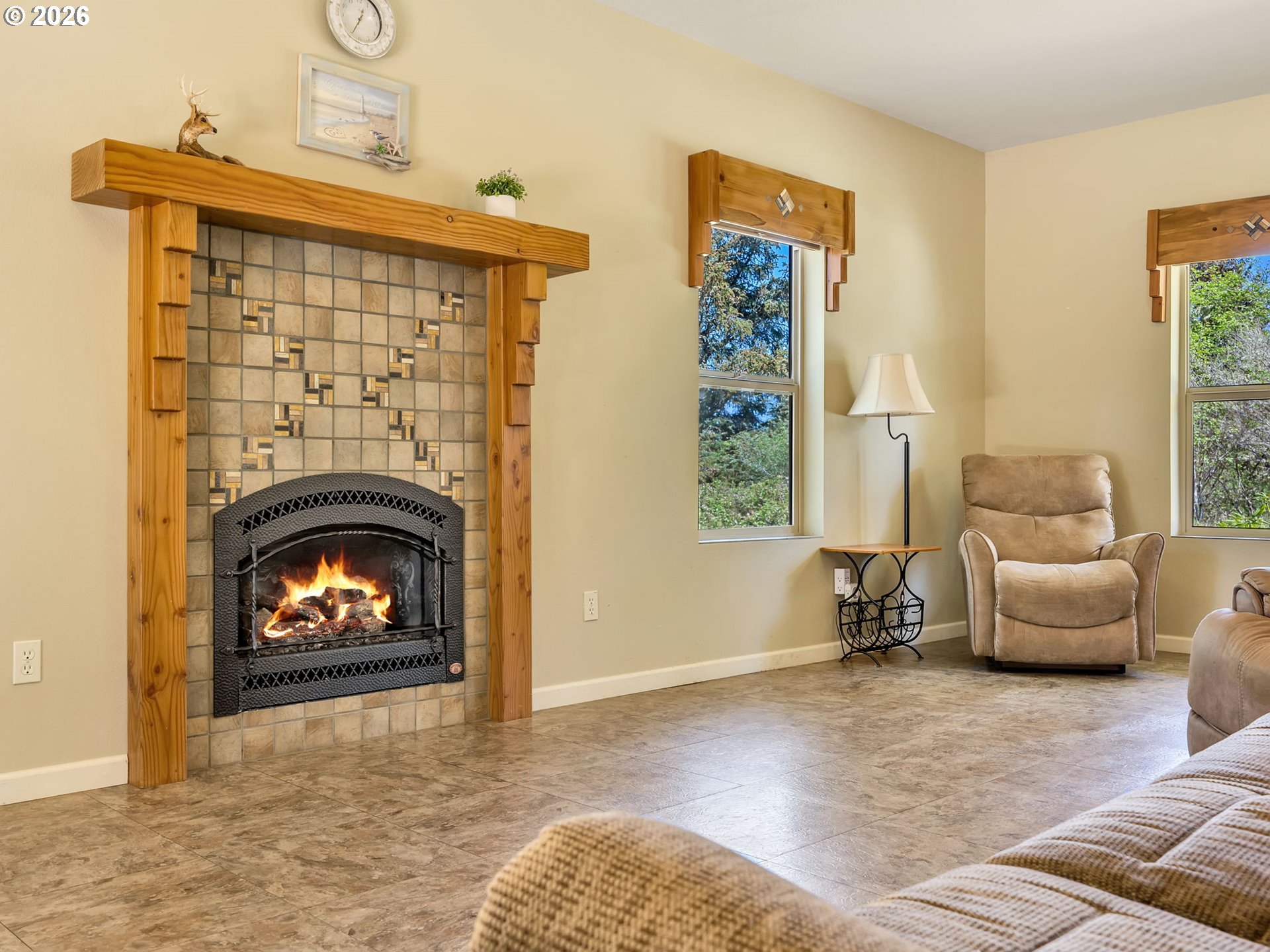 1077 Southwest Ridge Road Warrenton, OR 97146 - Photo 6 of 46 a living room with furniture and a fireplace