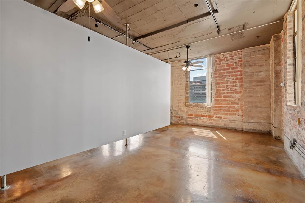 1122 Jackson Street, Unit 313 Dallas, TX 75202 - Photo 15 of 27 a view of a big room with windows