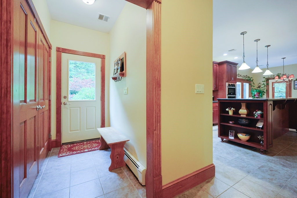 70 Azalea Way Hanson, MA 02341 - Photo 19 of 42 a room with furniture and a window