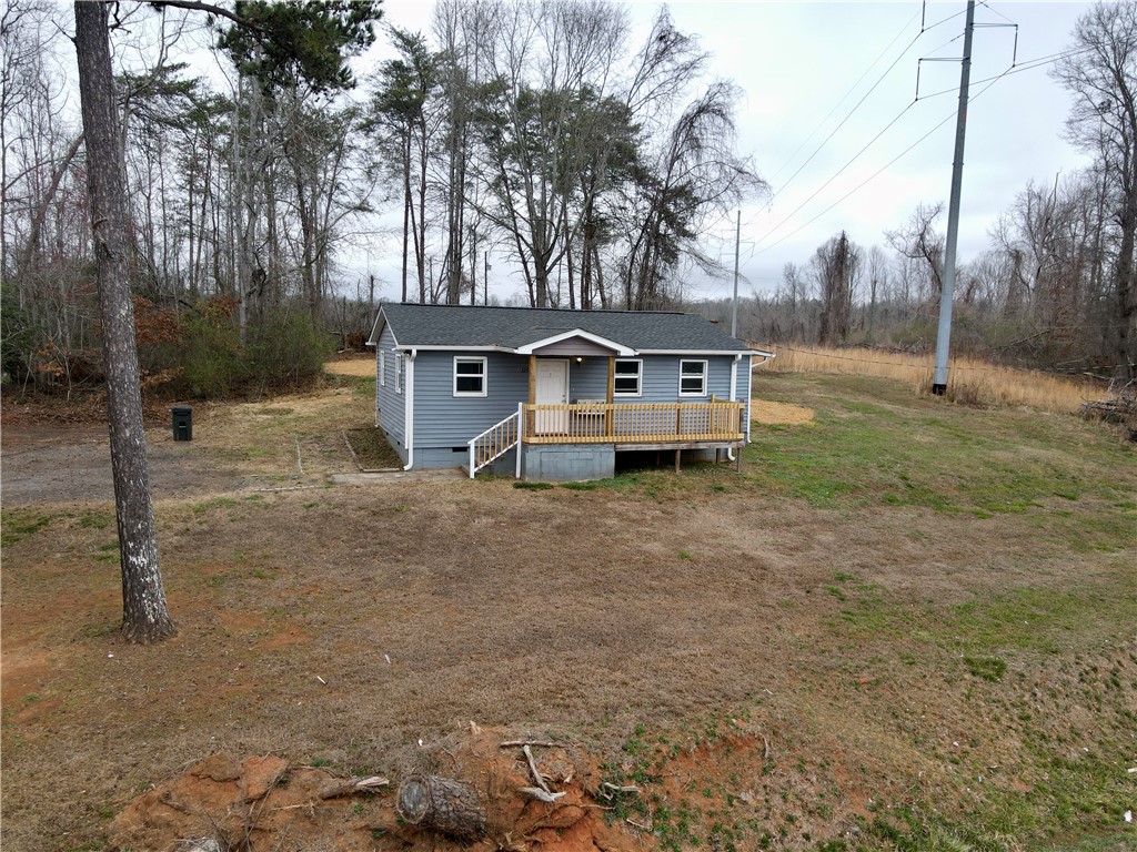 325 Rock Quarry Road Travelers Rest, SC 29690 - Photo 2 of 37 This inviting home offers comfortable living with a welcoming porch and natural surroundings.