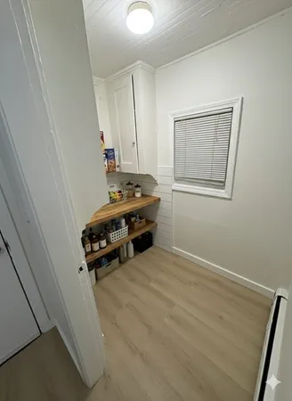 a room with a bed and a window