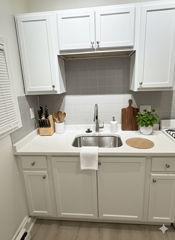36 Sagamore Street, Unit 3 Lynn, MA 01902 - Photo 2 of 19 a kitchen with a sink and cabinets