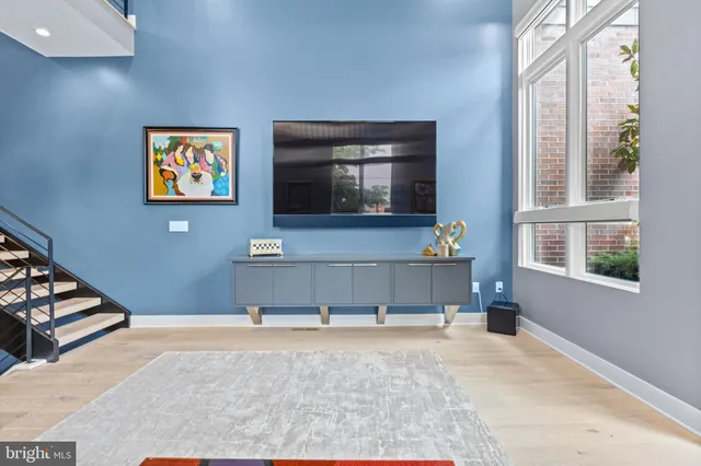 a view of an entryway with wooden floor