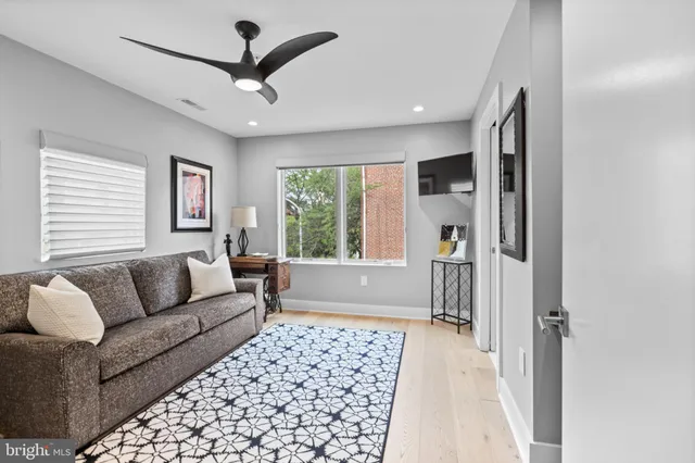 an aerial view of residential houses with outdoor space and parking