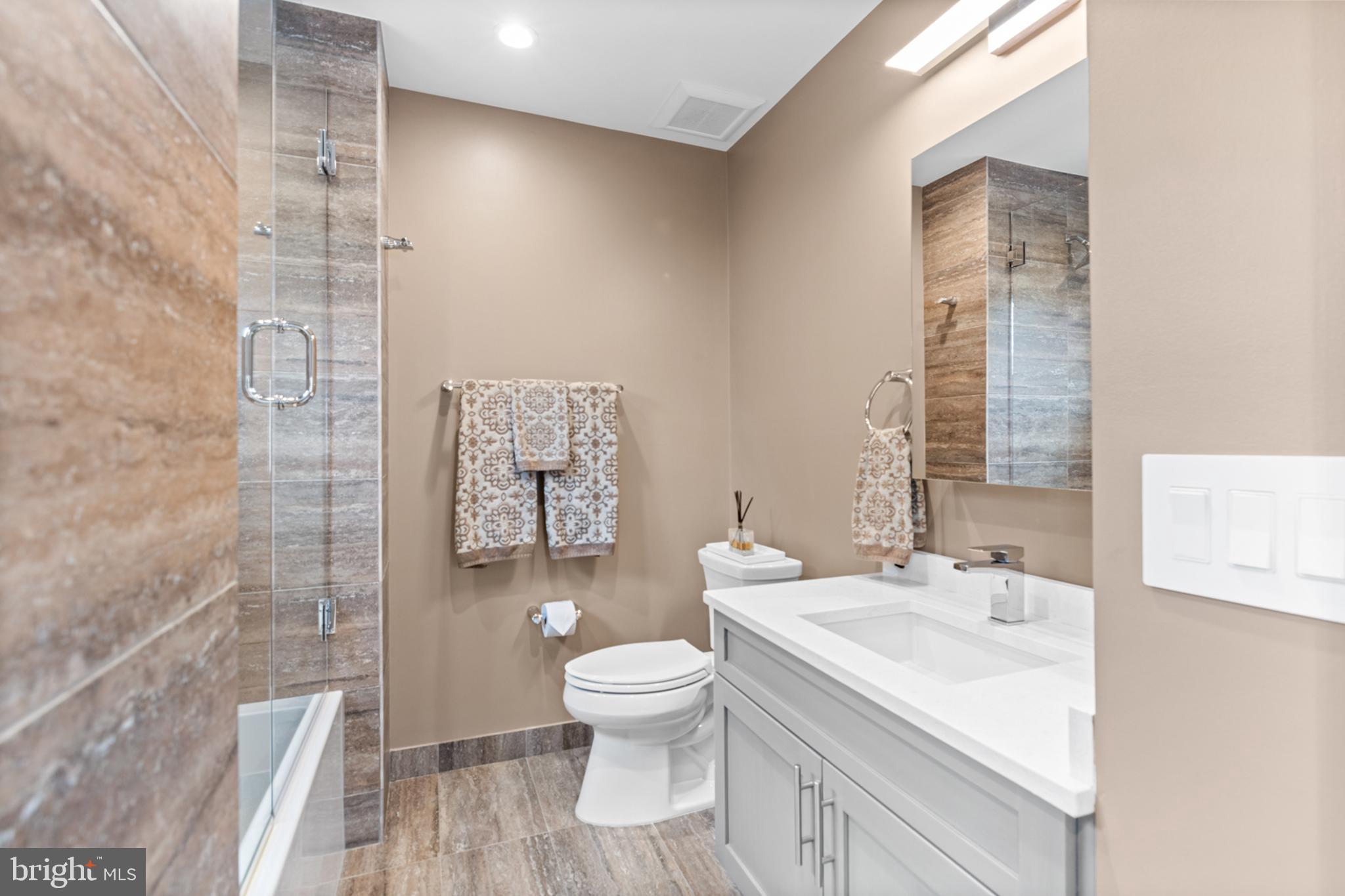 2147 Lombard Street Philadelphia, PA 19146 - Photo 32 of 107 a bathroom with a sink a toilet and shower