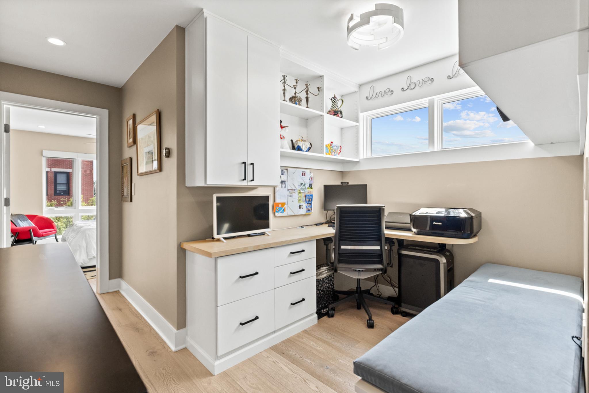 2147 Lombard Street Philadelphia, PA 19146 - Photo 35 of 107 a kitchen with stainless steel appliances wooden floor and a refrigerator