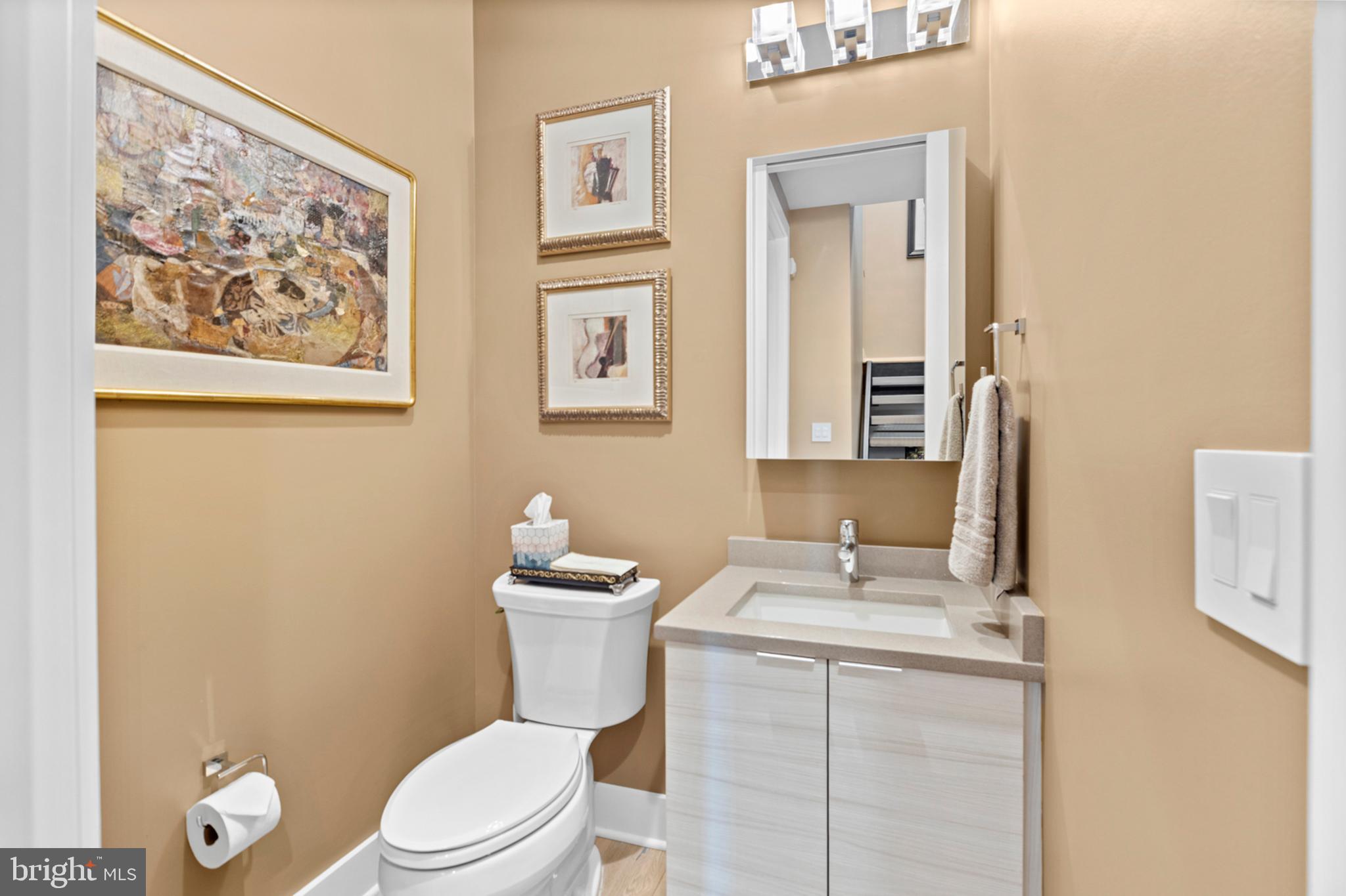 2147 Lombard Street Philadelphia, PA 19146 - Photo 42 of 107 a bathroom with a toilet a sink and mirror