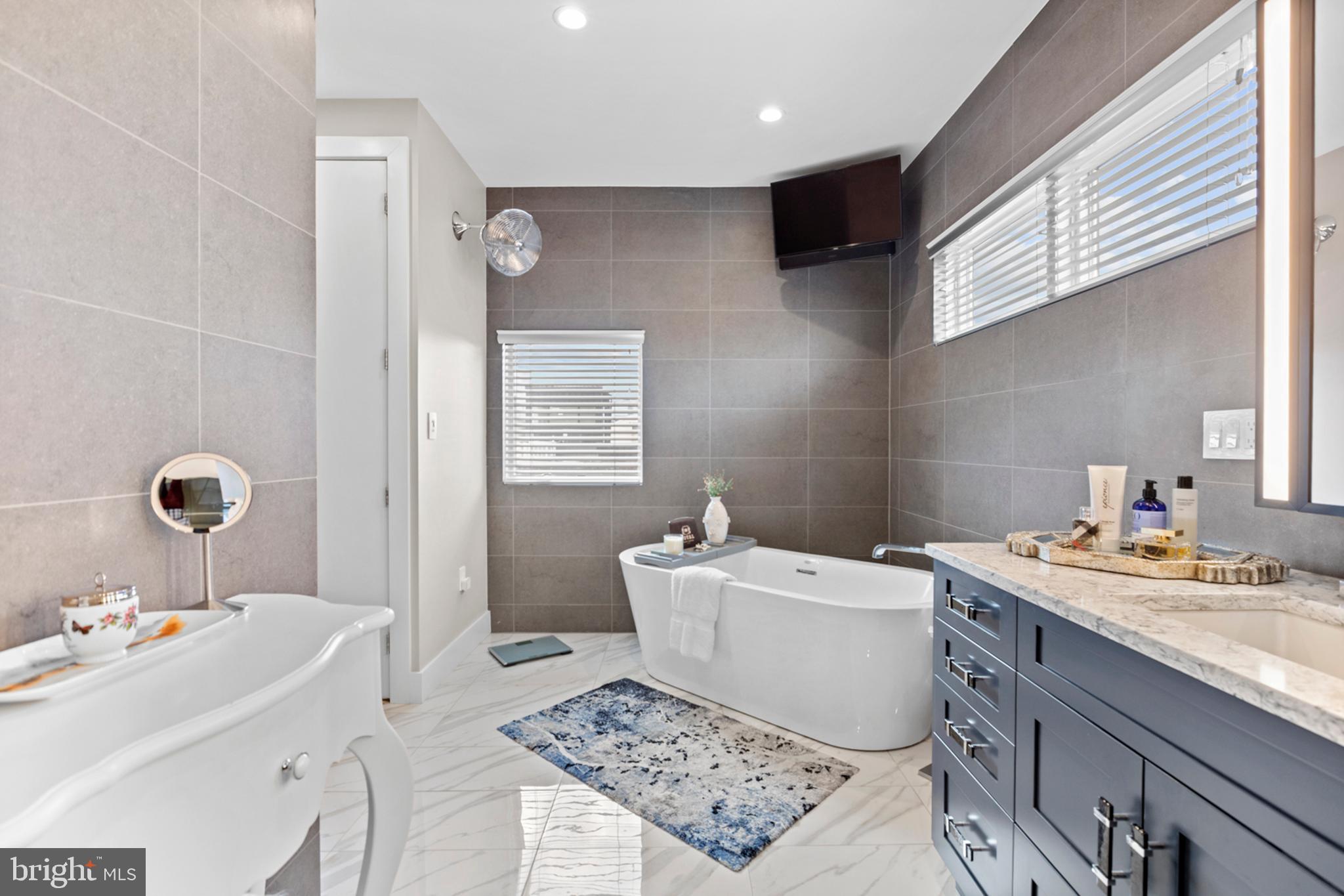 2147 Lombard Street Philadelphia, PA 19146 - Photo 46 of 107 a bathroom with a sink and a mirror