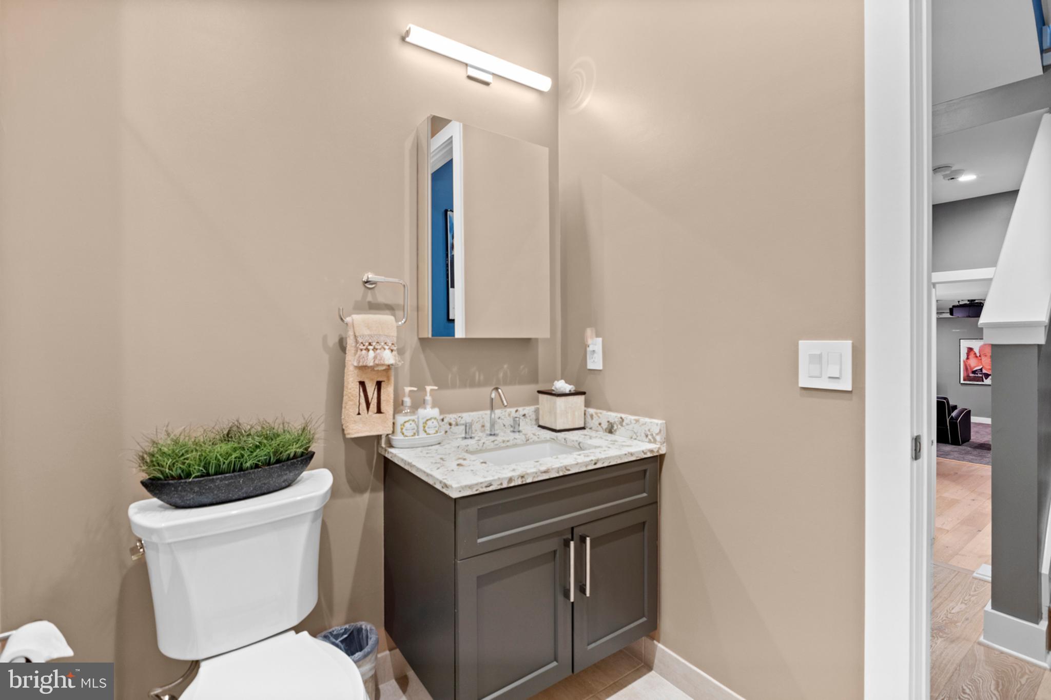 2147 Lombard Street Philadelphia, PA 19146 - Photo 67 of 107 a bathroom with a toilet sink and mirror