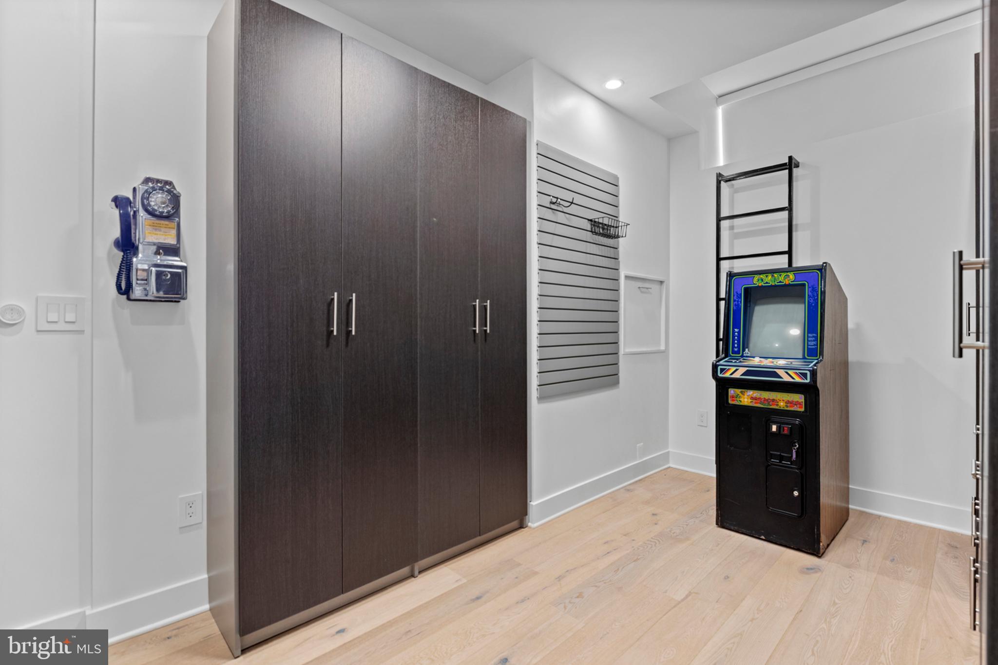 2147 Lombard Street Philadelphia, PA 19146 - Photo 70 of 107 a view of empty room with wooden floor and cabinet