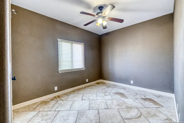 a bathroom with a granite countertop sink toilet tub and shower