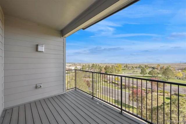 a view of balcony with wooden floor