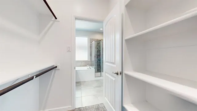 a view of a bathroom from a hallway