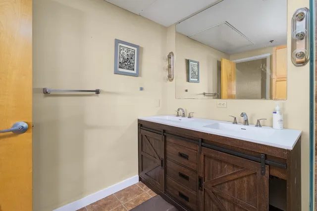 a bathroom with a sink and a mirror