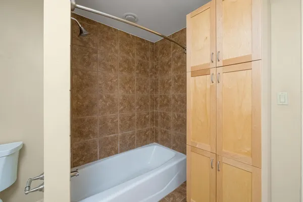 a bathroom with a bathtub and a shower