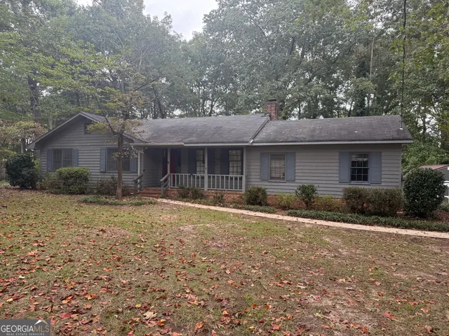 a front view of a house with a yard and porch
