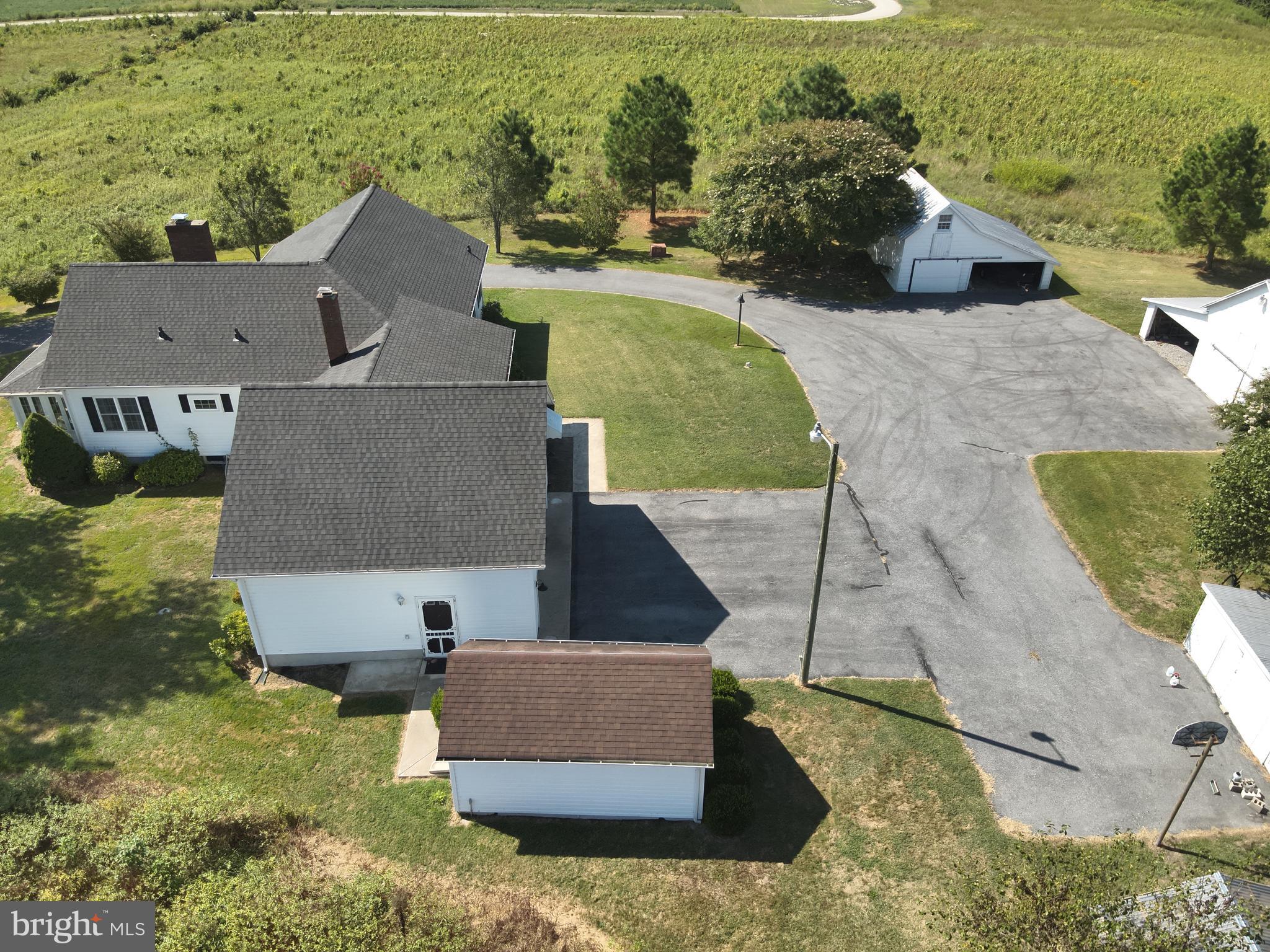 9449 Carey Road Berlin, MD 21811 - Photo 28 of 108 an aerial view of a house with a yard