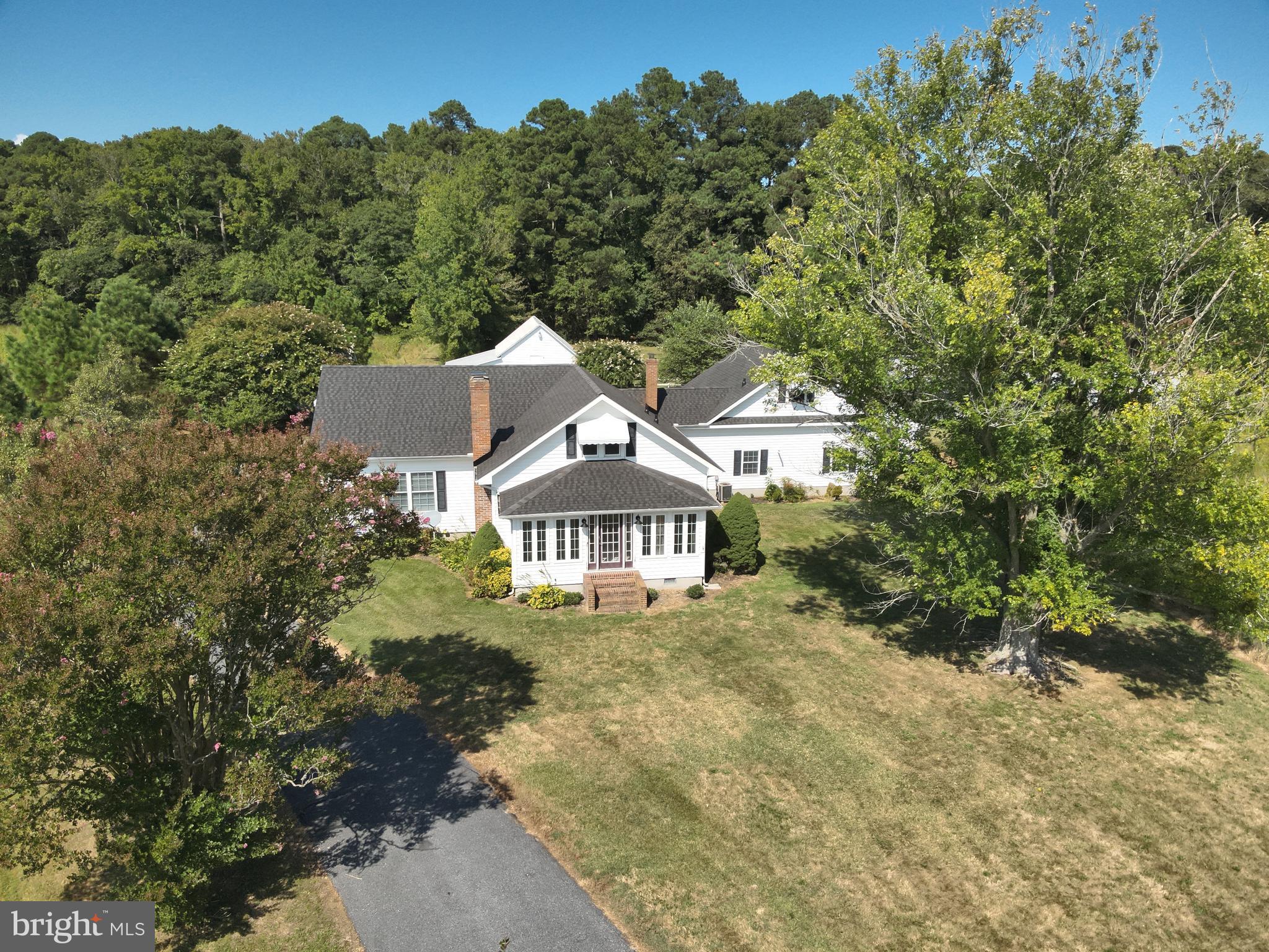 9449 Carey Road Berlin, MD 21811 - Photo 41 of 108 a front view of a house with a yard and lake view