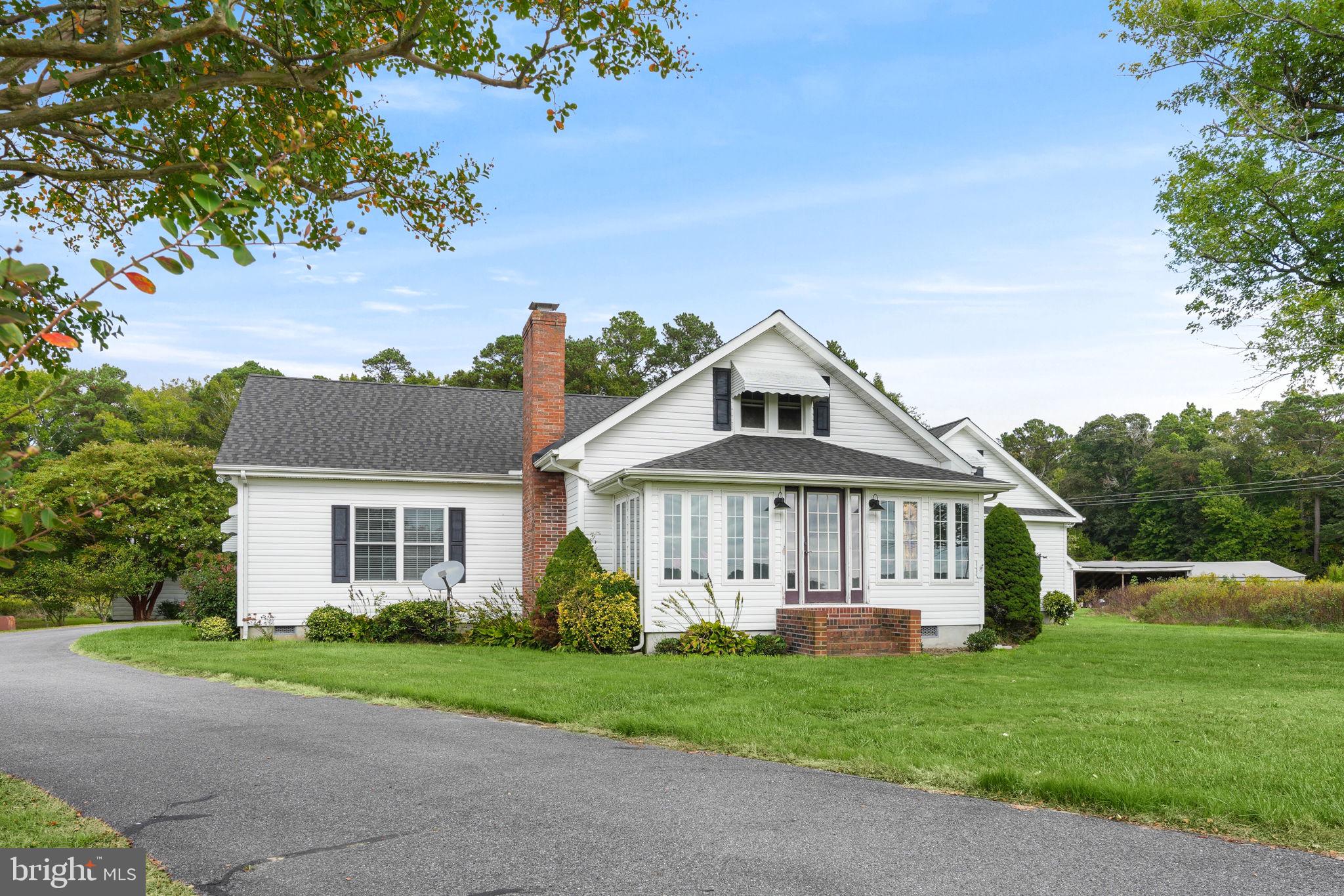 9449 Carey Road Berlin, MD 21811 - Photo 56 of 108 a front view of a house with a yard