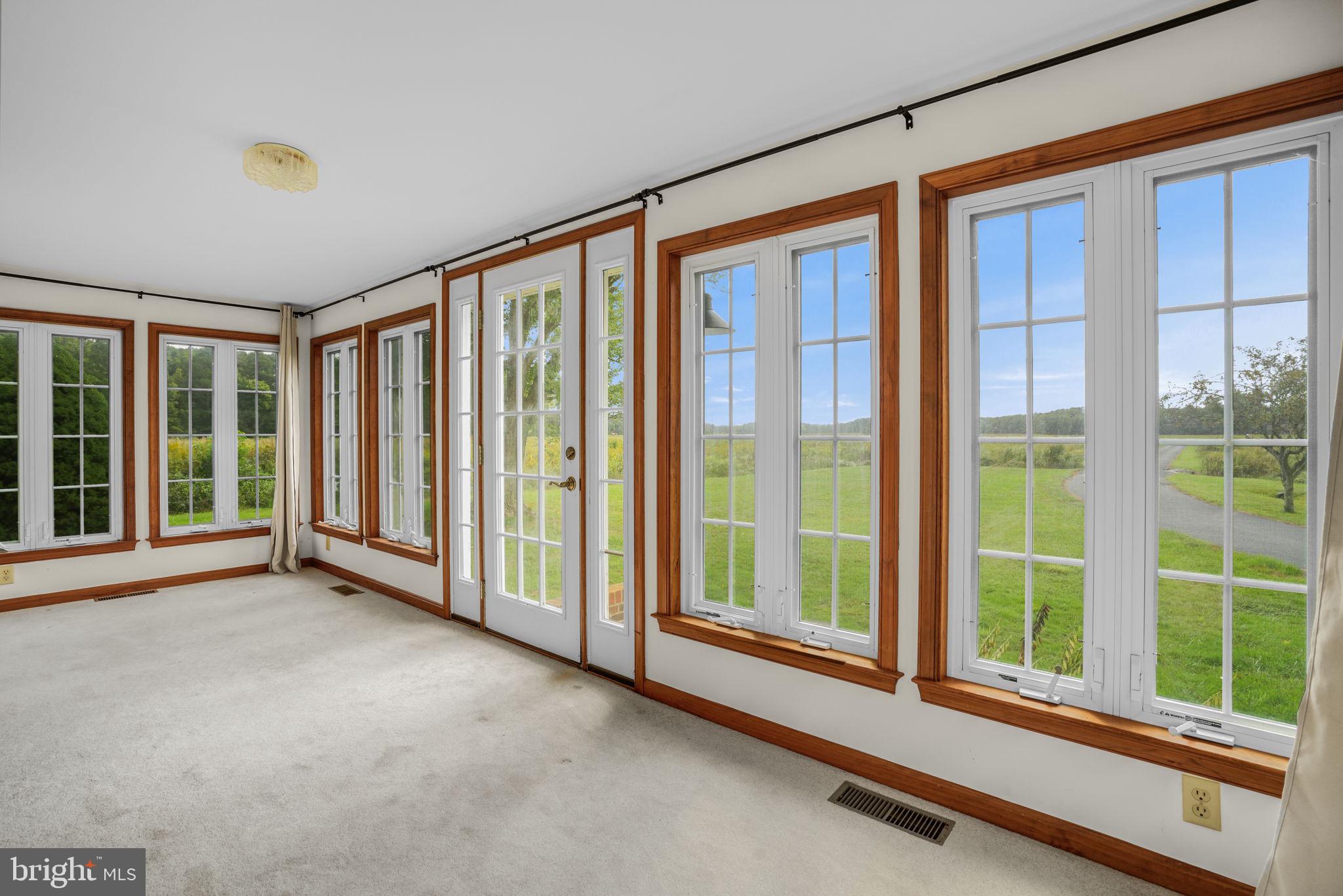 9449 Carey Road Berlin, MD 21811 - Photo 60 of 108 a view of room with floor to ceiling windows and floor to ceiling window
