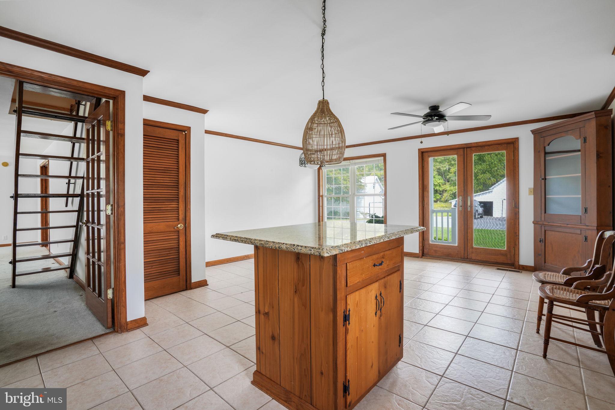 9449 Carey Road Berlin, MD 21811 - Photo 70 of 108 a kitchen with stainless steel appliances granite countertop a stove and a refrigerator