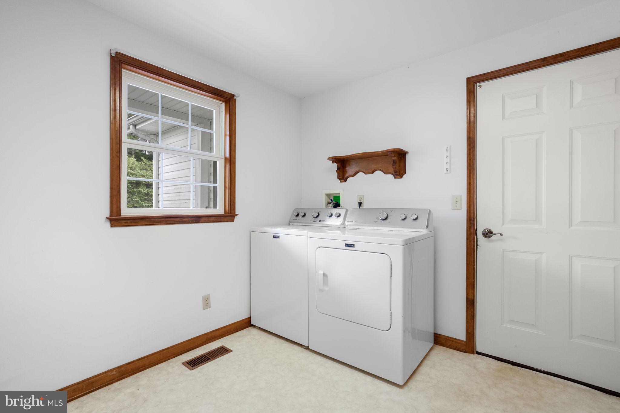 9449 Carey Road Berlin, MD 21811 - Photo 94 of 108 a utility room with dryer and washer