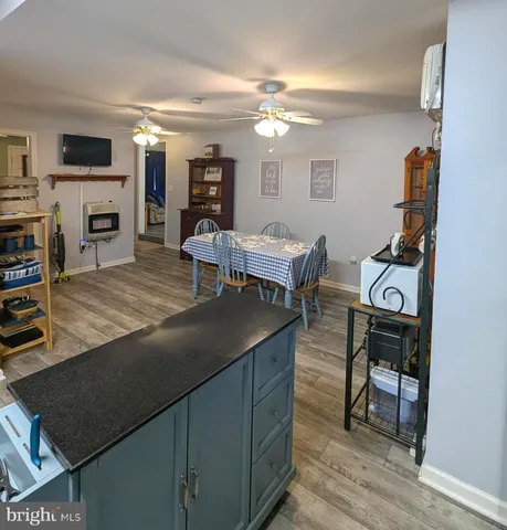 a living room with furniture a dining table and a piano table