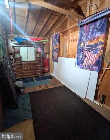 a bed sitting in a room next to a window