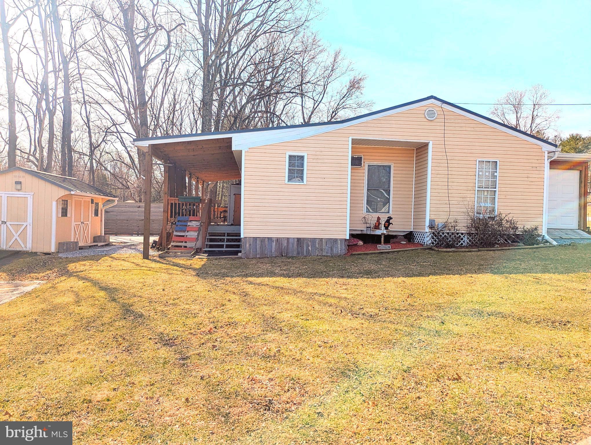 1 Ranger Road Falling Waters, WV 25419 - Photo 2 of 25 a view of a house with snow on the wall