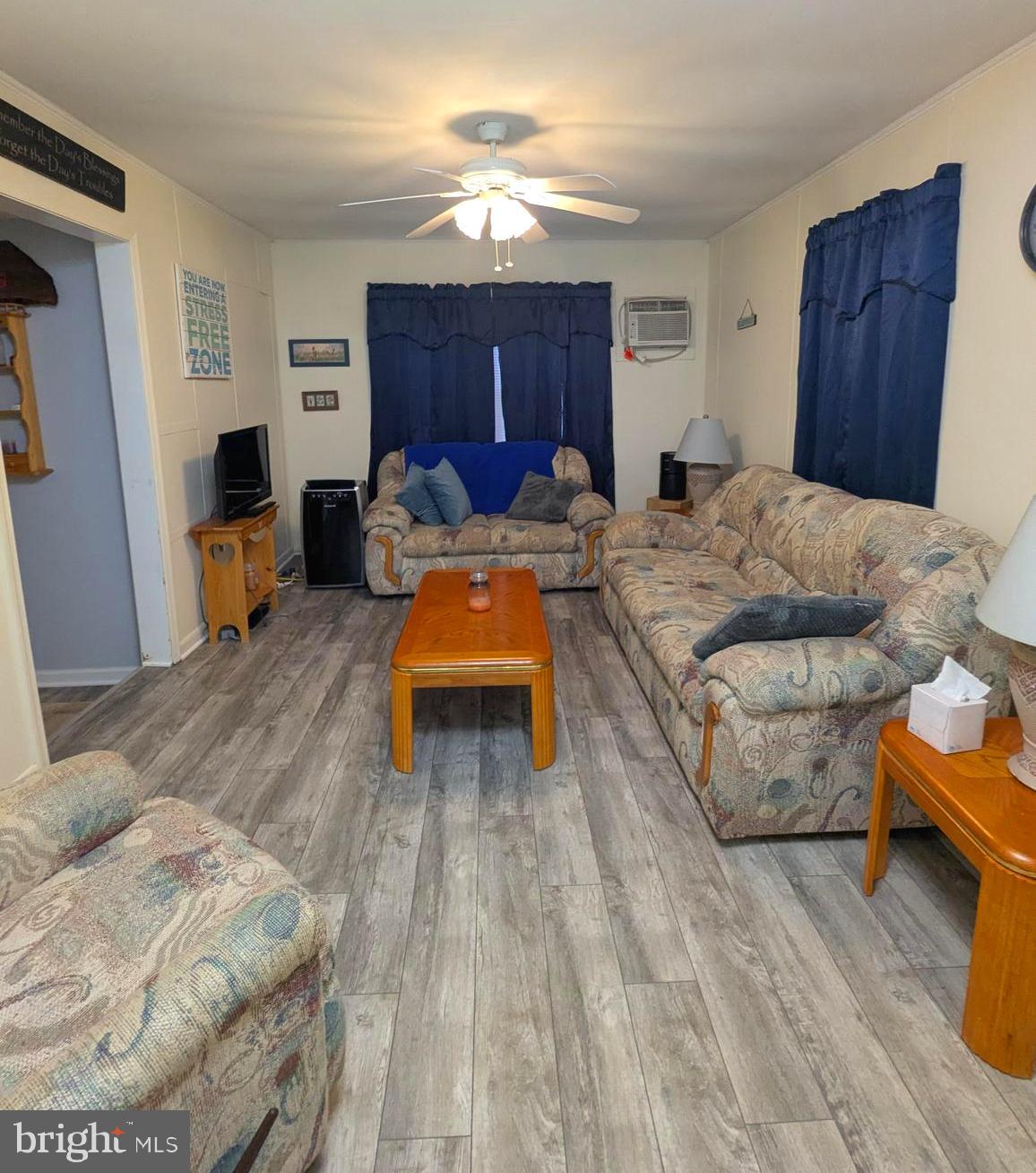 1 Ranger Road Falling Waters, WV 25419 - Photo 7 of 25 a living room with furniture and a wooden floor