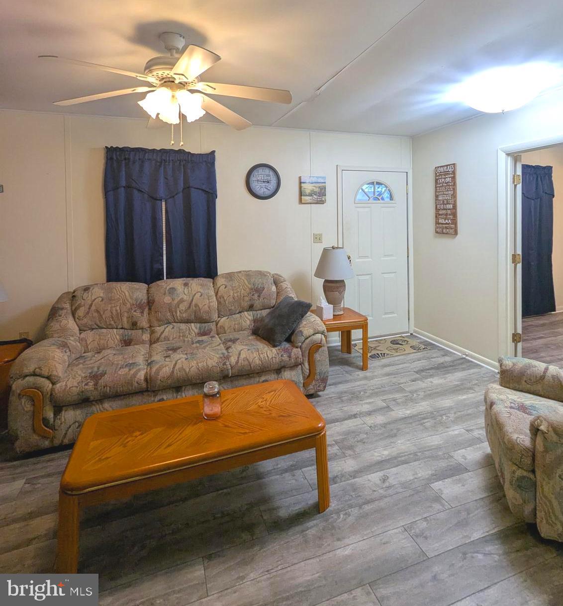 1 Ranger Road Falling Waters, WV 25419 - Photo 8 of 25 a living room with furniture and a flat screen tv
