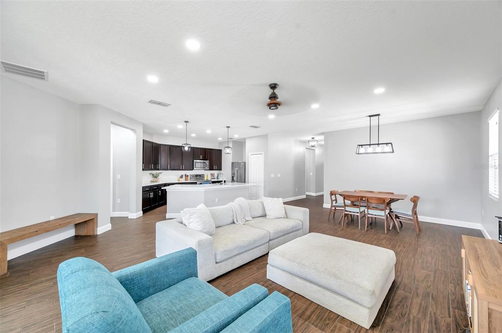 7523 Tangle Brook Boulevard Gibsonton, FL 33534 - Photo 11 of 35 a living room with furniture and view of kitchen