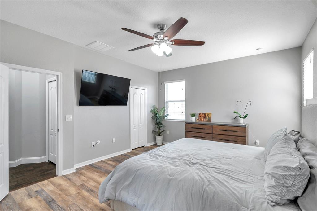 7523 Tangle Brook Boulevard Gibsonton, FL 33534 - Photo 16 of 35 a bedroom with a bed and a flat tv screen on dresser