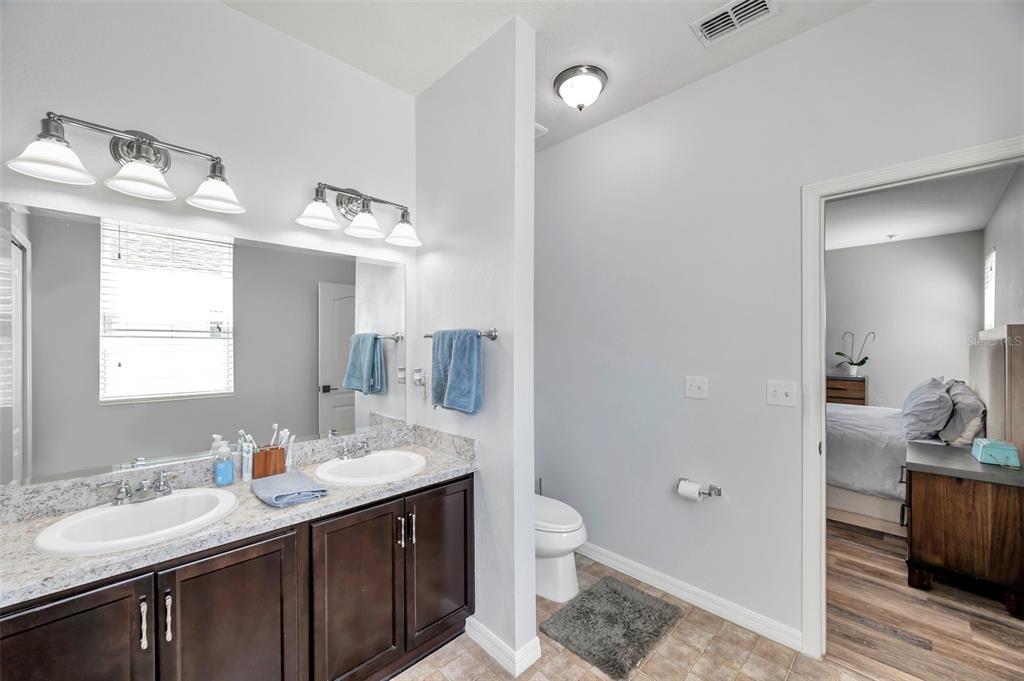 7523 Tangle Brook Boulevard Gibsonton, FL 33534 - Photo 18 of 35 a bathroom with a sink and a mirror