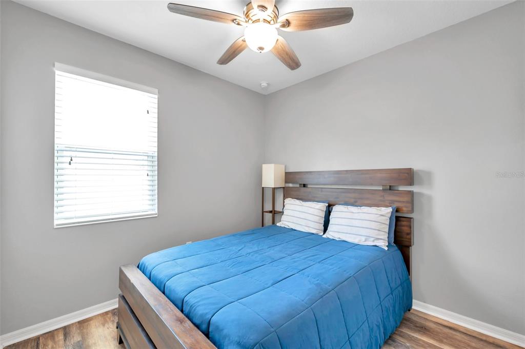 7523 Tangle Brook Boulevard Gibsonton, FL 33534 - Photo 19 of 35 a bedroom with a bed and window