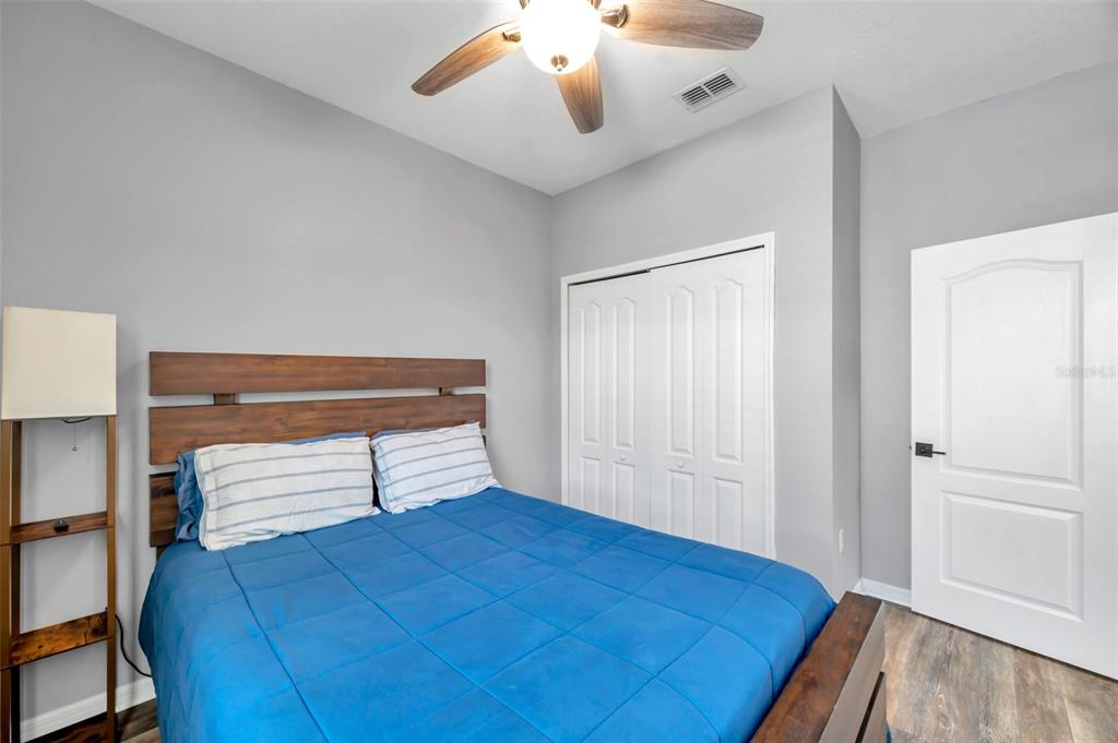 7523 Tangle Brook Boulevard Gibsonton, FL 33534 - Photo 20 of 35 a bedroom with a bed and a window