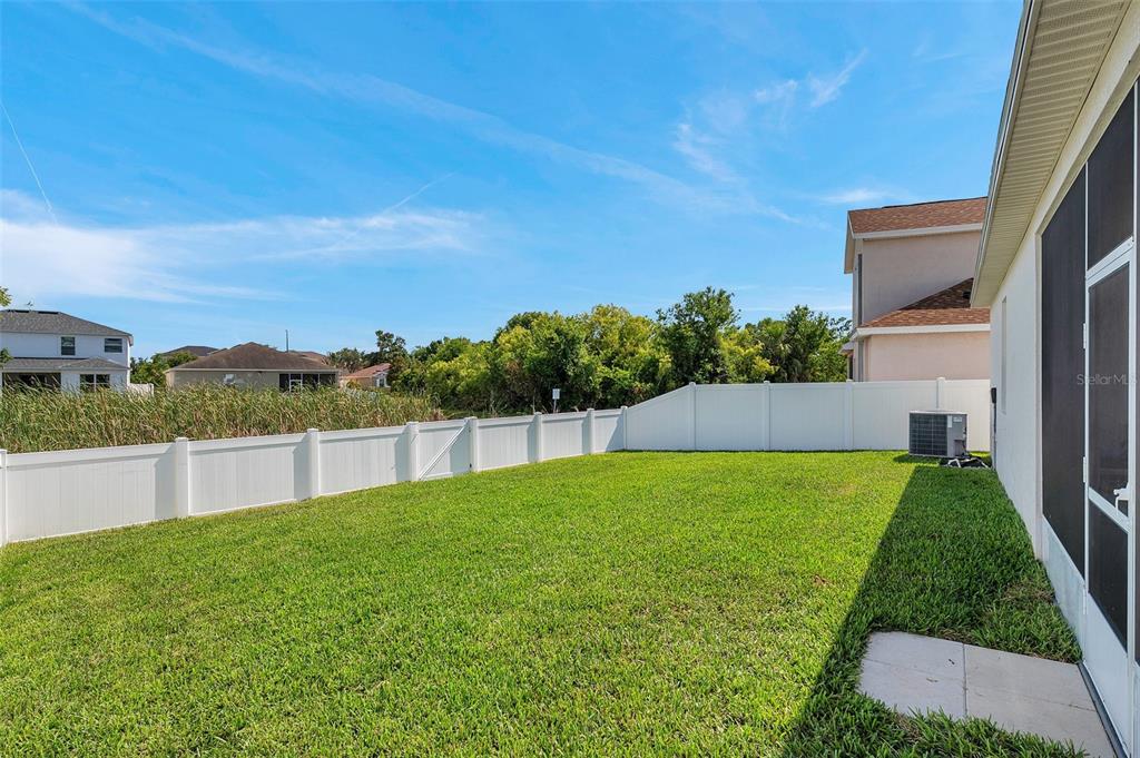 7523 Tangle Brook Boulevard Gibsonton, FL 33534 - Photo 30 of 35 a view of a backyard with large trees