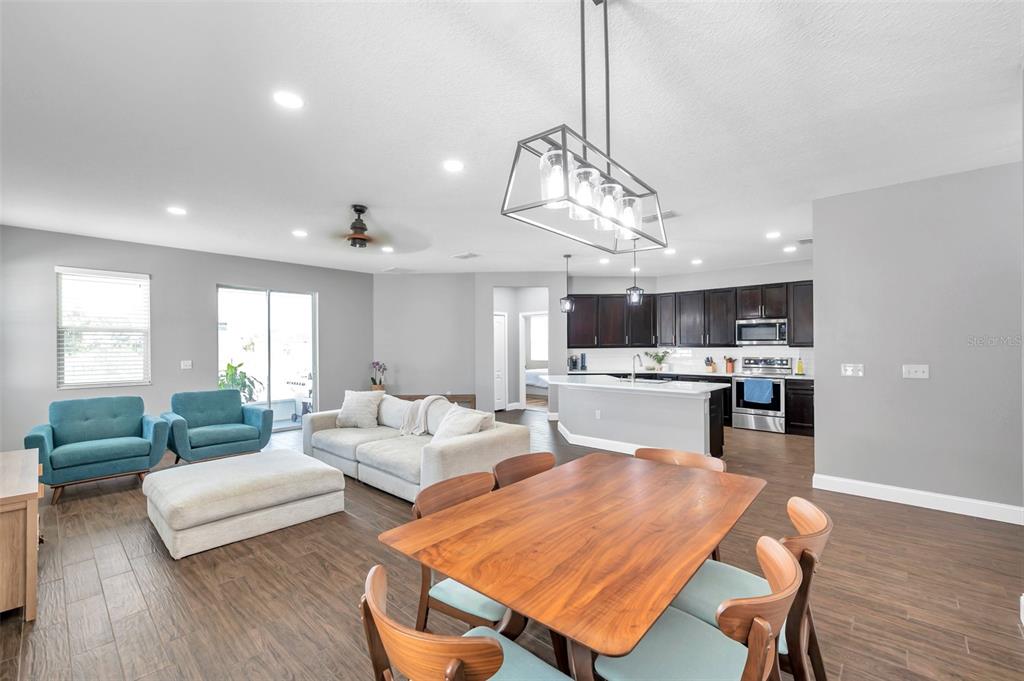 7523 Tangle Brook Boulevard Gibsonton, FL 33534 - Photo 3 of 35 a living room with furniture kitchen and a chandelier